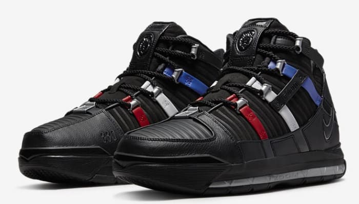 Side view of LeBron James' black and red Nike shoes.